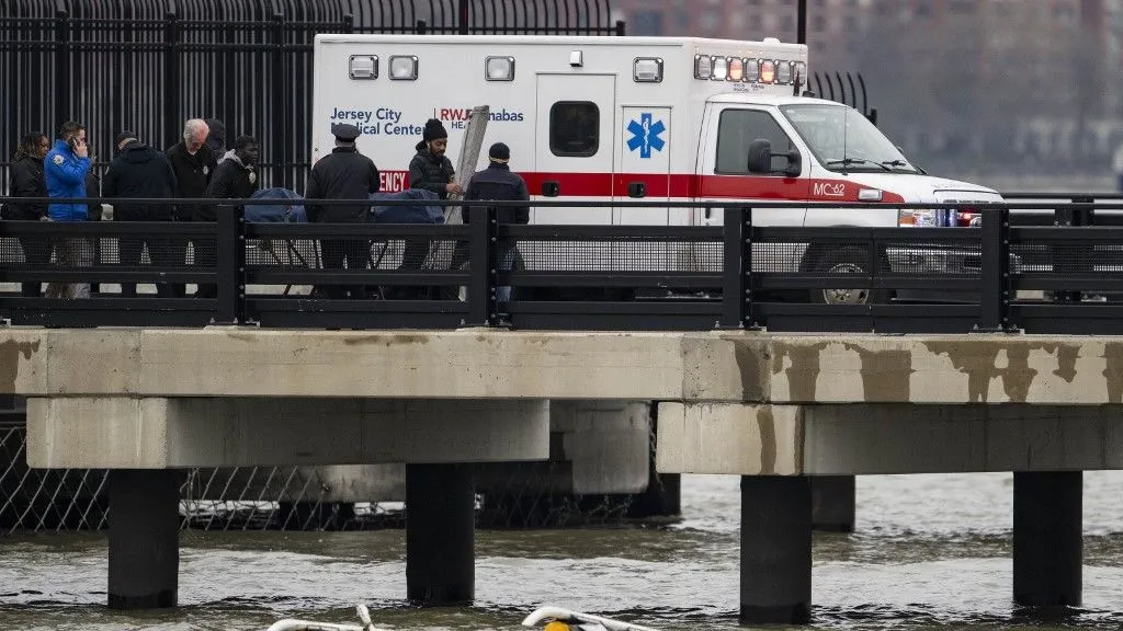 NEW YORK, UNITED STATES - APRIL 10: Medical examiners move bodies of the victims after a Helicopter crashed into the Hudson River near lower Manhattan, on April 10, 2025 in New York, United States. All 6 passengers dead from helicopter crash into Hudson River near lower Manhattan, New York City Mayor Adams confirms. Mostafa Bassim / Anadolu (Photo by Mostafa Bassim / ANADOLU / Anadolu via AFP)