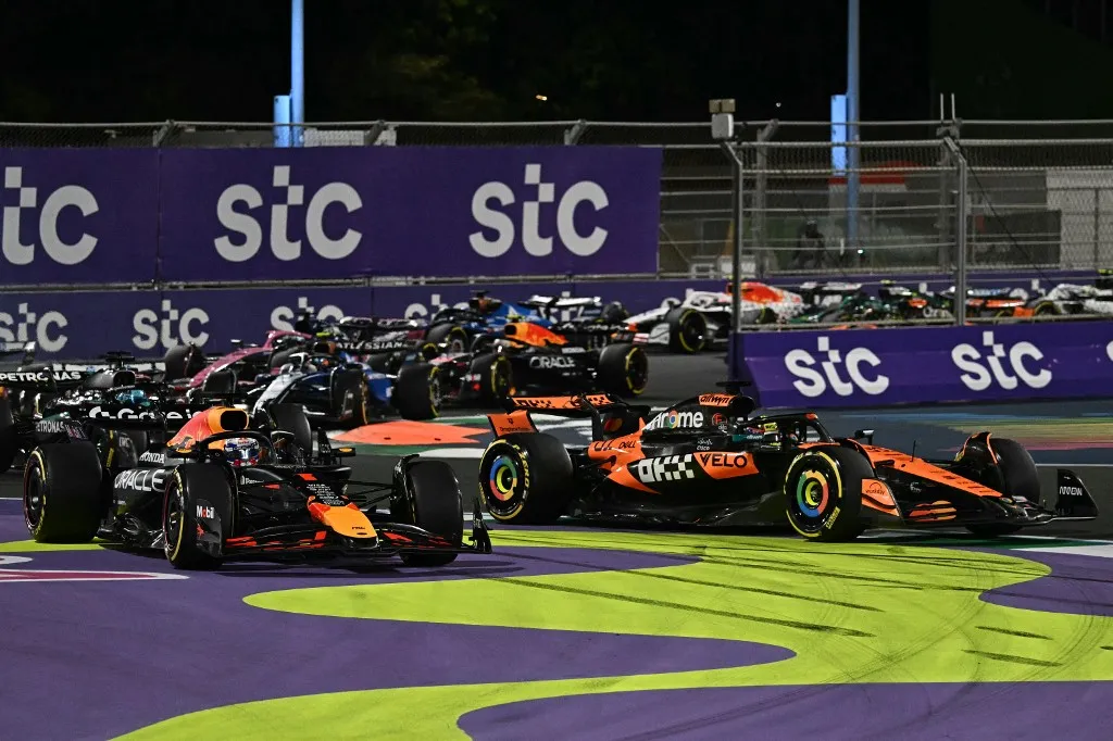 Red Bull Racing's Dutch driver Max Verstappen and McLaren's Australian driver Oscar Piastri race during the 2025 Saudi Arabia Formula One Grand Prix at the Jeddah Corniche Circuit on April 20, 2025. (Photo by Gabriel BOUYS / AFP)
