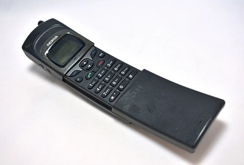 Nokia 8110 banana mobile phone displayed on white background in Bangkok on March 6, 2018.