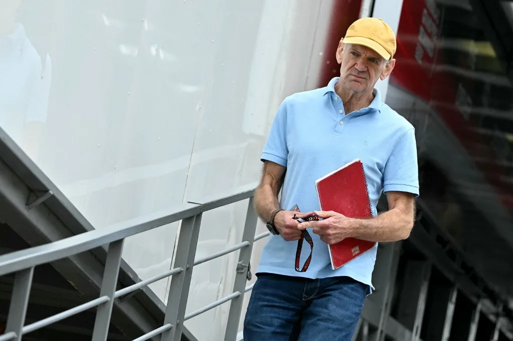 Red Bull Racing's technical chief Adrian Newey arrives in the pits of the Circuit de Monaco before the second practice session of the Formula One Monaco Grand Prix on May 24, 2024, two days ahead of the race. (Photo by ANDREJ ISAKOVIC / AFP)