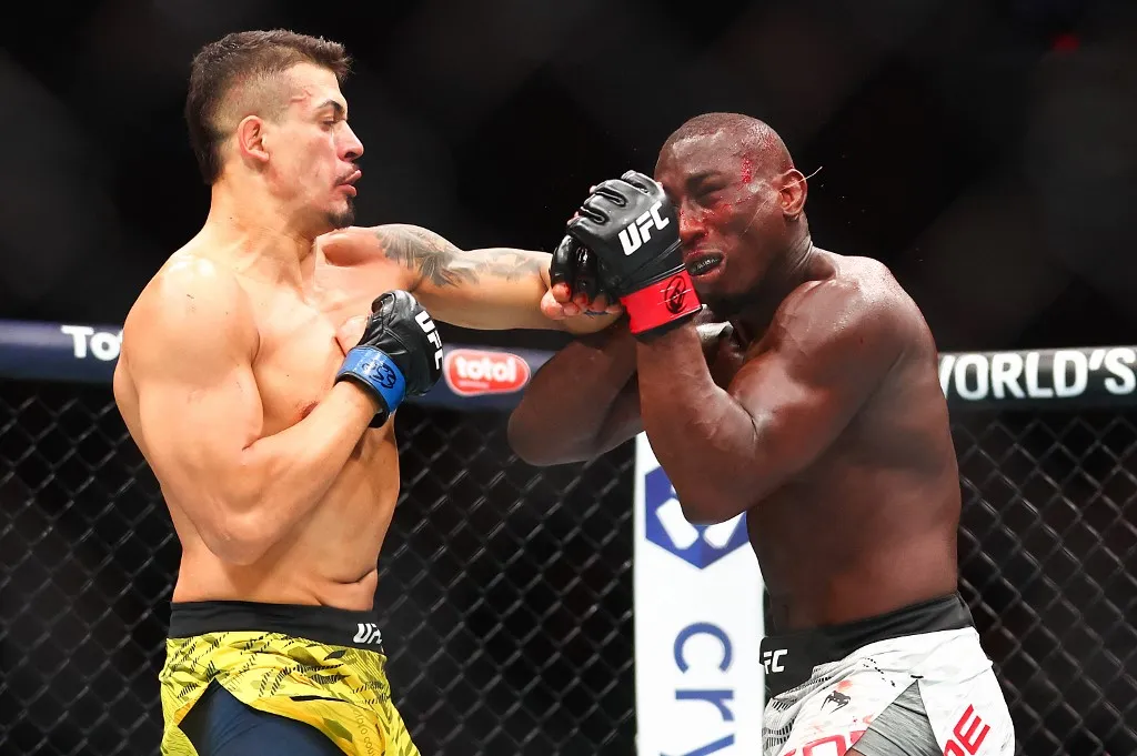 MIAMI, FLORIDA - APRIL 12: Marco Tulio of Brazil punches Tresean Gore in a middleweight bout during the UFC 314 event at Kaseya Center on April 12, 2025 in Miami, Florida.   Megan Briggs/Getty Images/AFP (Photo by Megan Briggs / GETTY IMAGES NORTH AMERICA / Getty Images via AFP)