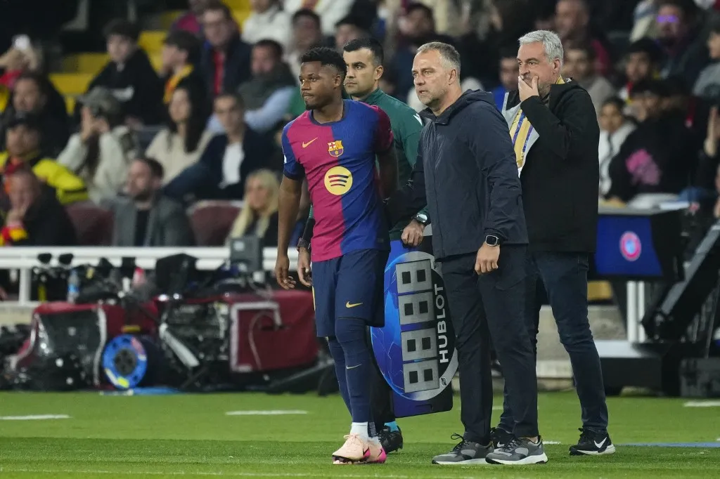 Hansi Flick head coach of Barcelona and Ansu Fati left winger of Barcelona and Spain during the UEFA Champions League 2024/25 Quarter Final First Leg match between FC Barcelona and Borussia Dortmund at Estadi Olimpic Lluis Companys on April 9, 2025 in Barcelona, Spain. (Photo by Jose Breton/Pics Action/NurPhoto) (Photo by Jose Breton / NurPhoto / NurPhoto via AFP)