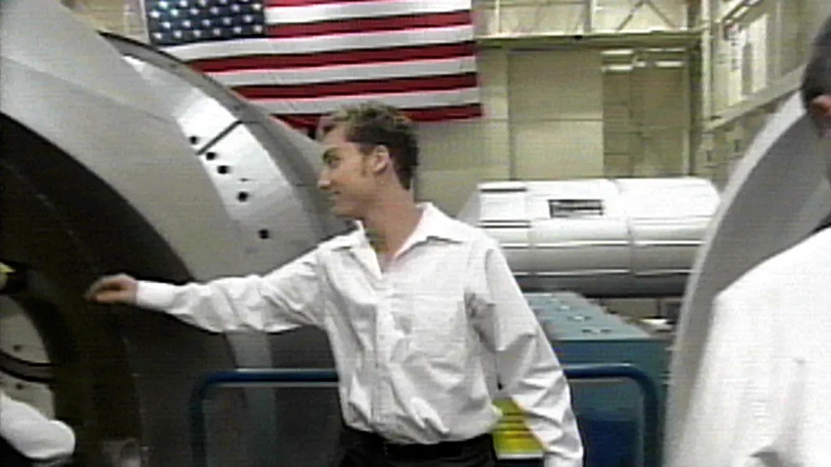 This photo from a 26 August, 2002, Nasa video shows Soyuz 5 taxi crewmember US Lance Bass of the band 'N Sync entering the International Space Station mock up at Johnson Space Center (JSC), Texas, 26 August. Bass along with Soyuz 5 Commander Russian Sergie Zalyotin and Flight Engineer Belgian Frank Dewine are at JSC for a week of training on station operations in preparation for their 28 October launch to the station.         AFP PHOTO/NASA VIDEO (Photo by NASA VIDEO / AFP)