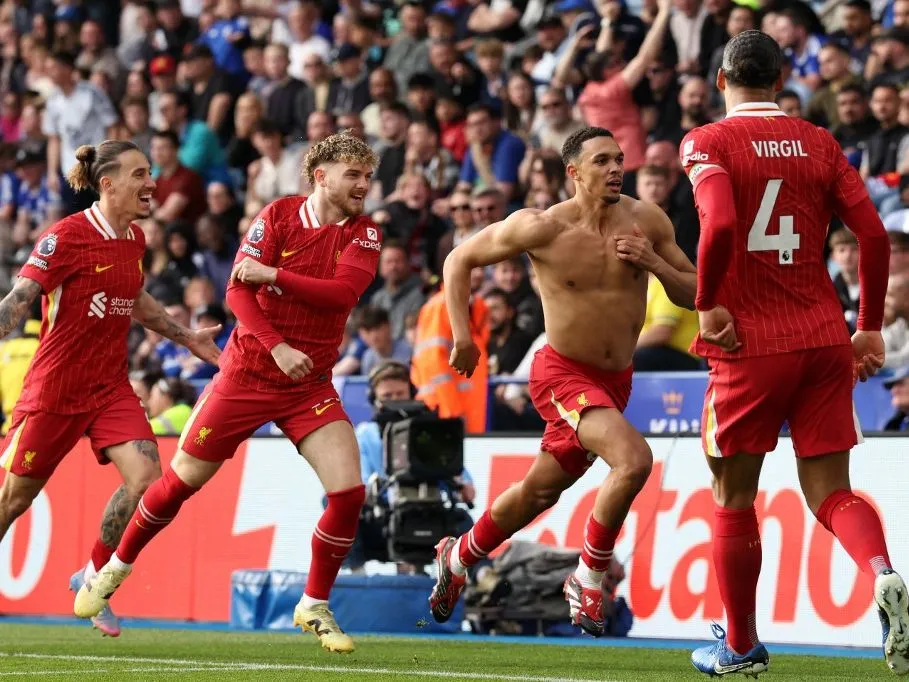 Liverpool's English defender #66 Trent Alexander-Arnold (2R) celebrates after scoring the opening goal of the English Premier League football match between Leicester City and Liverpool at King Power Stadium in Leicester, central England on April 20, 2025. (Photo by Darren Staples / AFP) / RESTRICTED TO EDITORIAL USE. No use with unauthorized audio, video, data, fixture lists, club/league logos or 'live' services. Online in-match use limited to 120 images. An additional 40 images may be used in extra time. No video emulation. Social media in-match use limited to 120 images. An additional 40 images may be used in extra time. No use in betting publications, games or single club/league/player publications. / 