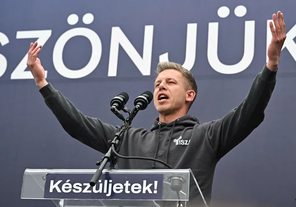 Leader of TISZA party Peter Magyar addresses activists and sympathisers of Hungary's main opposition party, the TISZA (Respect and Freedom) during a rally in Budapest on April 13, 2025. The TISZA party has concluded a two-week self-styled "referendum" on Sunday, The initiative -- dubbed "Voice of the Nation" -- is widely seen as a mobilisation exercise ahead of the election scheduled for next spring. (Photo by Attila KISBENEDEK / AFP)