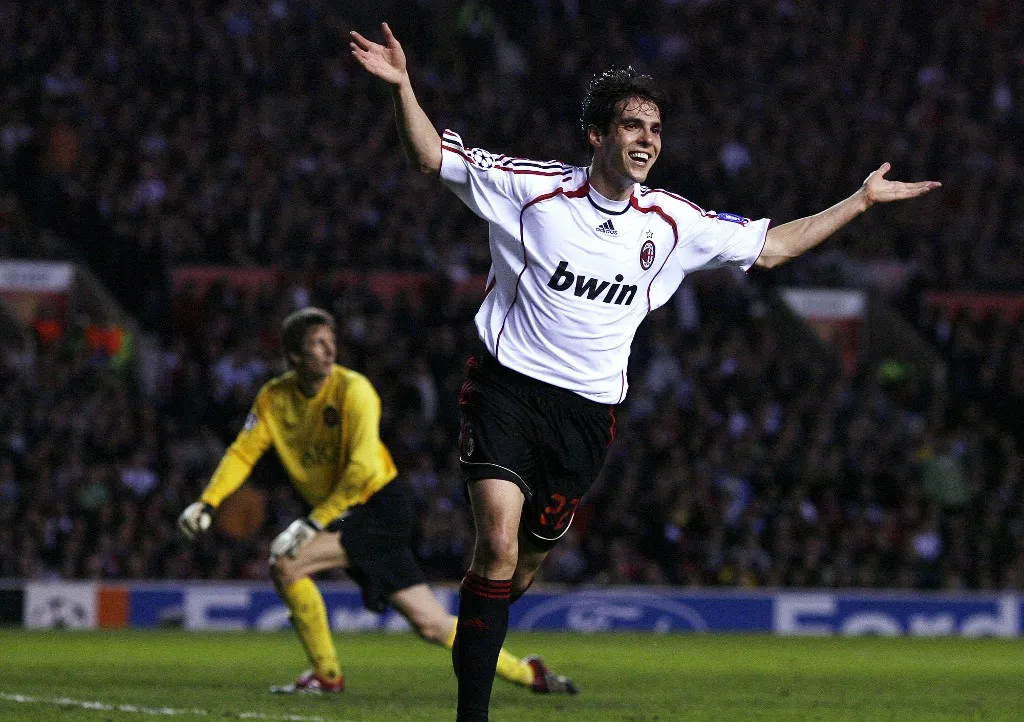 AC Milan's Brazilian midfielder Ricardo Kaka (R) celebrates scoring his second goal past Manchester United's Dutch goalkeeper Edwin Van der Sar during their European Champions League semi final first leg football match at Old Trafford in Manchester, north west England, 24 April 2007. AFP PHOTO/ANDREW YATES (Photo by ANDREW YATES / AFP)
