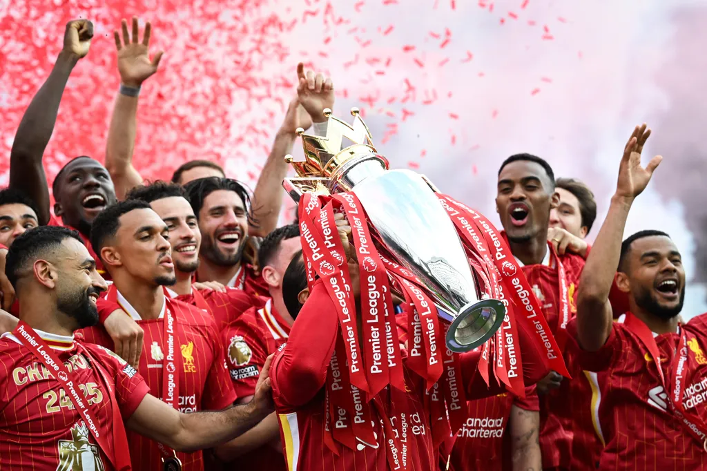 Szoboszlai, Liverpool's celebrate with the Premier League trophy at the end of the English Premier League football match between Liverpool and Crystal Palace at Anfield in Liverpool, north west England on May 25, 2025. Liverpool equalises 1 - 1 against Cr