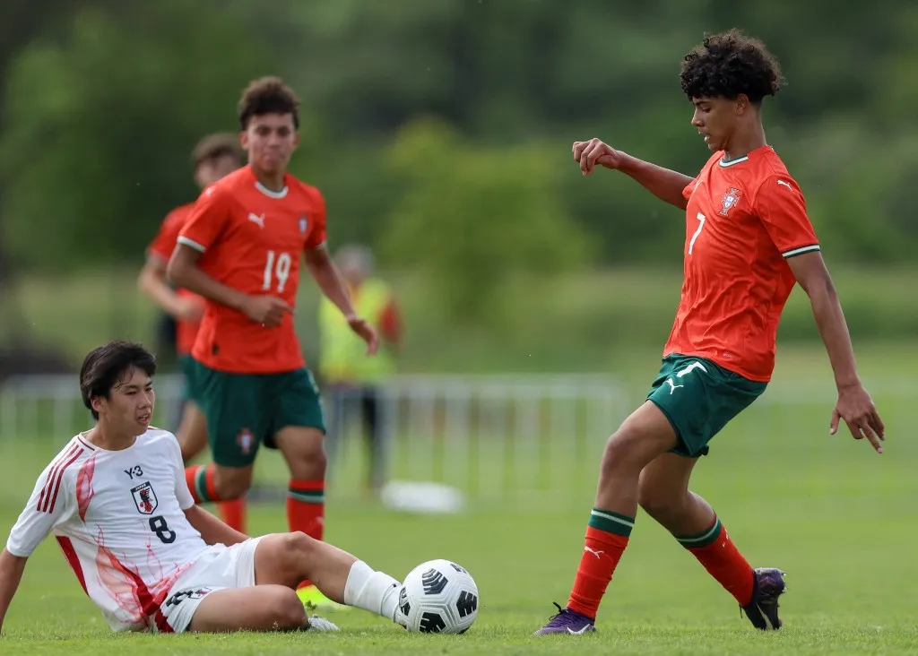 Portugal's U15 national football team player Cristiano Dos Santos (R), son of Cristiano Ronaldo, vies with Japan's Sakuto Fukaya during a match between Portugal and Japan as part of the Vlatko-Markovic U15 youth tournament in Sveti Martin na Muri on May 13 2025. (Photo by DAMIR SENCAR / AFP)