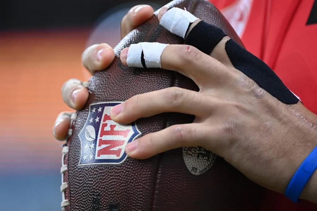 Kansas City Chiefs quarterback Patrick Mahomes warms up with the ball prior to the NFL game between Miami Dolphins and Kansas City Chiefs at the Waldstadion in Frankfurt am Main, western Germany on November 5, 2023. (Photo by Kirill KUDRYAVTSEV / AFP)