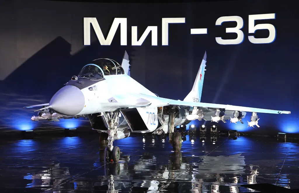 A Russian multipurpose jet fighter MiG-35 is displayed on a podium during its presentation at the MiG plant in Lukhovitsy on January 27, 2017. The MiG-35 jet fighter is a further development of the MiG-29. (Photo by Marina LYSTSEVA / AFP)