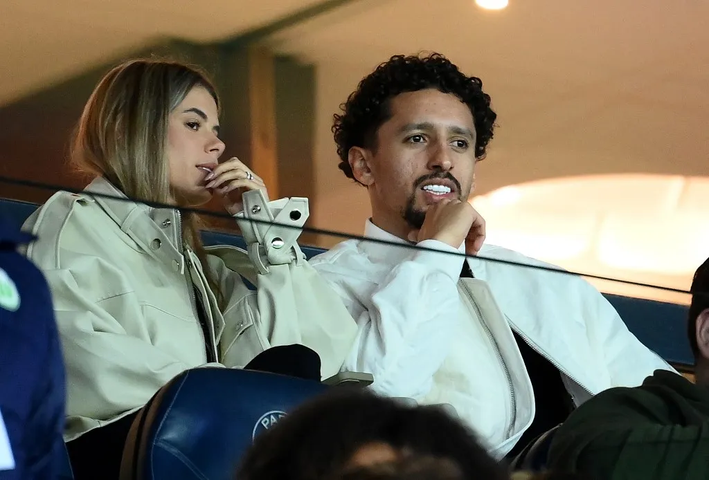 Paris Saint-Germain's Brazilian defender Marquinhos (R) and his wife Carol Cabrino arrive for the UEFA Women's Champions League quarter-final first-leg match between Paris Saint-Germain (PSG) and Wolfsburg (VFL) at the Parc des Princes stadium in Paris on March 22, 2023. (Photo by FRANCK FIFE / AFP)