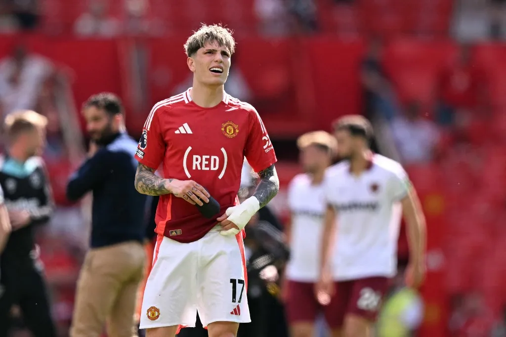 Manchester United's Argentinian midfielder #17 Alejandro Garnacho reacts after the English Premier League football match between Manchester United and West Ham United at Old Trafford in Manchester, north west England, on May 11, 2025. West Ham won the game 2-0. (Photo by Oli SCARFF / AFP) / RESTRICTED TO EDITORIAL USE. No use with unauthorized audio, video, data, fixture lists, club/league logos or 'live' services. Online in-match use limited to 120 images. An additional 40 images may be used in extra time. No video emulation. Social media in-match use limited to 120 images. An additional 40 images may be used in extra time. No use in betting publications, games or single club/league/player publications. / 