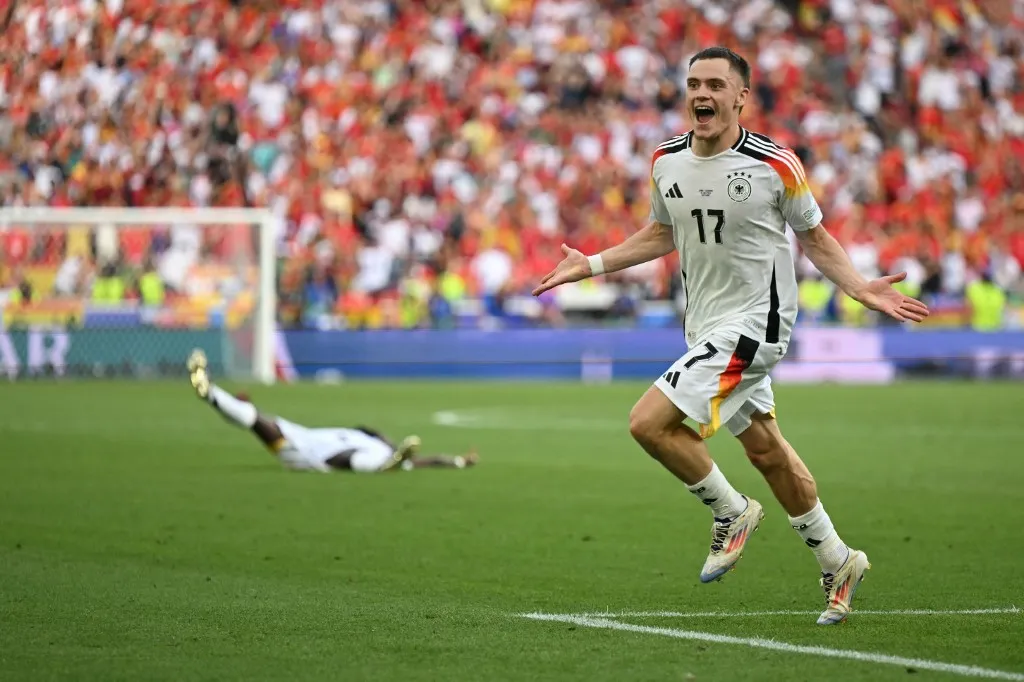 Germany's midfielder #17 Florian Wirtz celebrates scoring his team's first goal during the UEFA Euro 2024 quarter-final football match between Spain and Germany at the Stuttgart Arena in Stuttgart on July 5, 2024. (Photo by Fabrice COFFRINI / AFP)