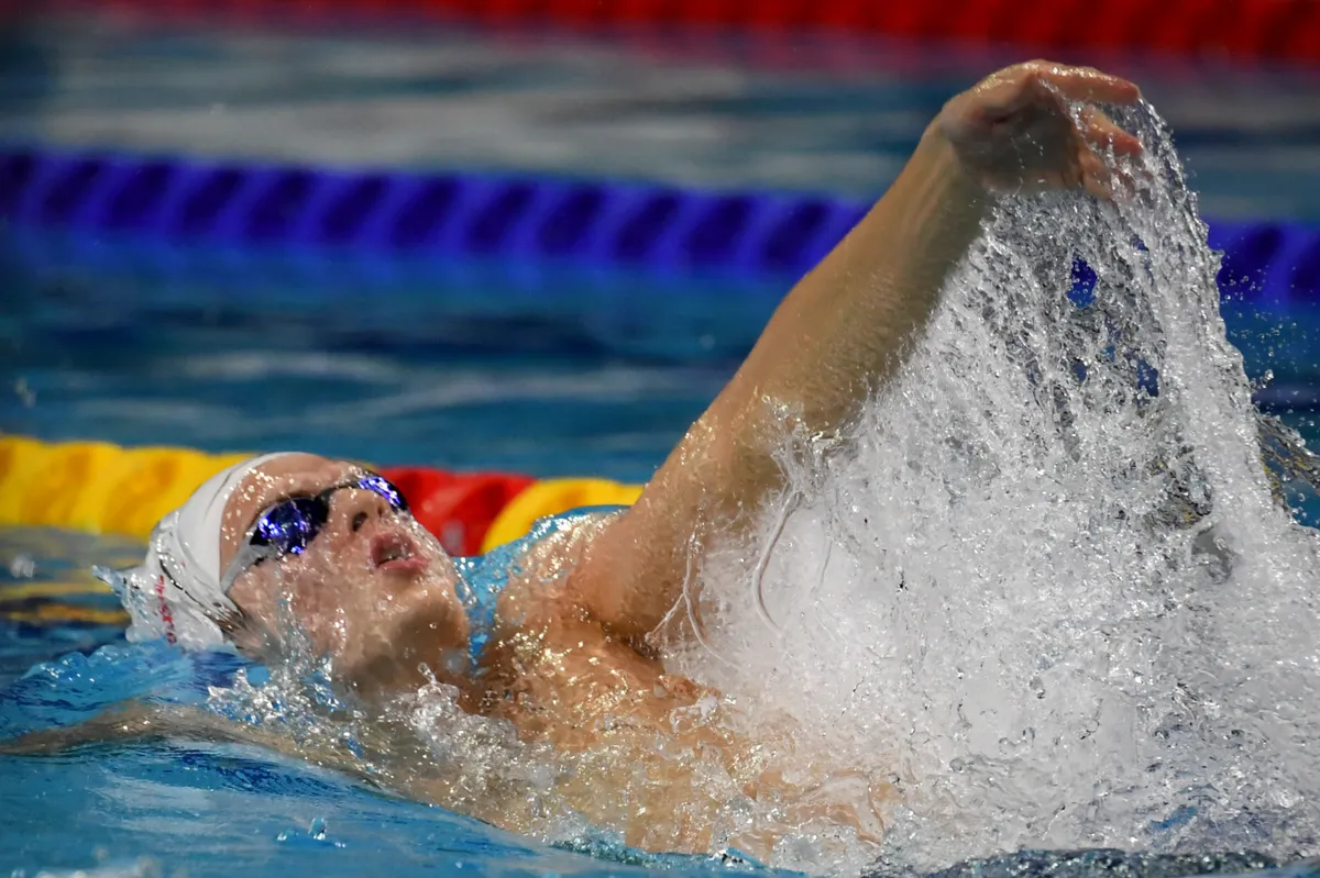 Hungarys Kós Hubert competes in the Mens 200 meters Backstroke final during the World Aquatics Swimming Championships (25 m) 2024 at Duna Arena in Budapest, on December 15, 2024. (Photo by Ferenc ISZA / AFP)