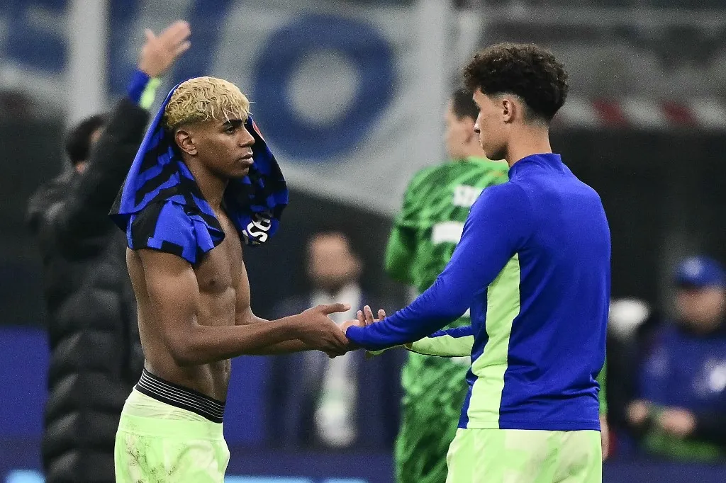 Barcelona's Spanish forward #19 Lamine Yamal (L) reacts after Inter Milan won the UEFA Champions League semi-final second leg football match between Inter Milan and FC Barcelona at the San Siro stadium in Milan on May 6, 2025. (Photo by Marco BERTORELLO / AFP)
