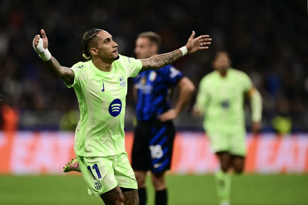 Barcelona's Brazilian forward #11 Raphinha celebrates scoring his team's third goal during the UEFA Champions League semi-final second leg football match between Inter Milan and FC Barcelona at the San Siro stadium in Milan on May 6, 2025. (Photo by Marco BERTORELLO / AFP)
