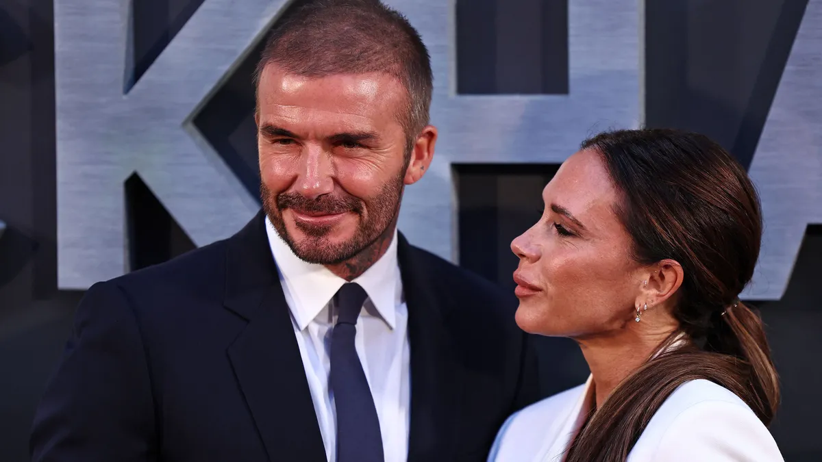 Former England footballer David Beckham and his wife Victoria Beckham pose on the red carpet upon arrival to attend the Premiere of "Beckham" in London on October 3, 2023. (Photo by HENRY NICHOLLS / AFP)