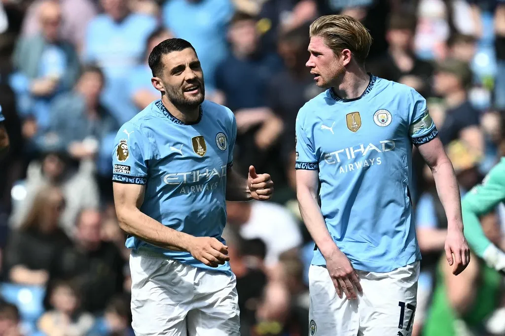 Kevin de Bruyne, Manchester City's Croatian midfielder #08 Mateo Kovacic (L) celebrates with Manchester City's Belgian midfielder #17 Kevin De Bruyne (R) after scoring their third goal during the English Premier League football match between Manchester City and Crystal Palace at the Etihad Stadium in Manchester, north west England, on April 12, 2025. (Photo by Paul ELLIS / AFP) / RESTRICTED TO EDITORIAL USE. No use with unauthorized audio, video, data, fixture lists, club/league logos or 'live' services. Online in-match use limited to 120 images. An additional 40 images may be used in extra time. No video emulation. Social media in-match use limited to 120 images. An additional 40 images may be used in extra time. No use in betting publications, games or single club/league/player publications. / 