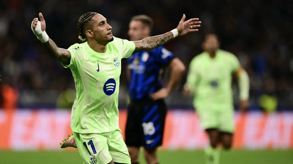 Barcelona's Brazilian forward #11 Raphinha celebrates scoring his team's third goal during the UEFA Champions League semi-final second leg football match between Inter Milan and FC Barcelona at the San Siro stadium in Milan on May 6, 2025. (Photo by Marco BERTORELLO / AFP)