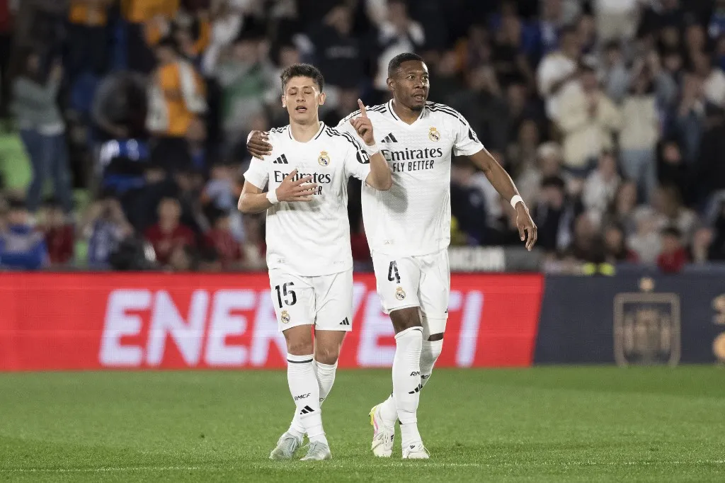 Arda Guler of Real Madrid and David Alaba of Real Madrid celebrate a goal during the La Liga 2024/25 match between Getafe and Real Madrid at Coliseum Stadium in Madrid, Spain, on April 23. (Photo by Guillermo Martinez/NurPhoto) (Photo by Guillermo Martinez / NurPhoto / NurPhoto via AFP)