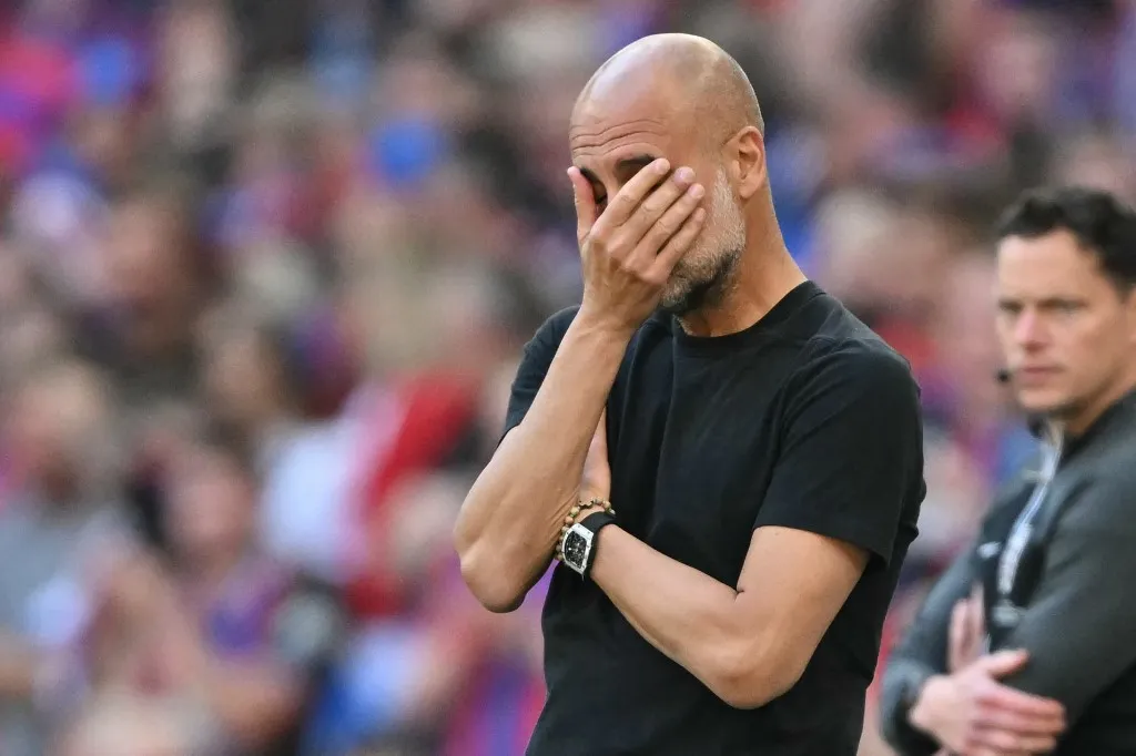 Manchester City's Spanish manager Pep Guardiola gestures on the touchline during the English FA Cup final football match between Crystal Palace and Manchester City at Wembley stadium in London, on May 17, 2025. (Photo by Glyn KIRK / AFP) / NOT FOR MARKETING OR ADVERTISING USE / RESTRICTED TO EDITORIAL USE