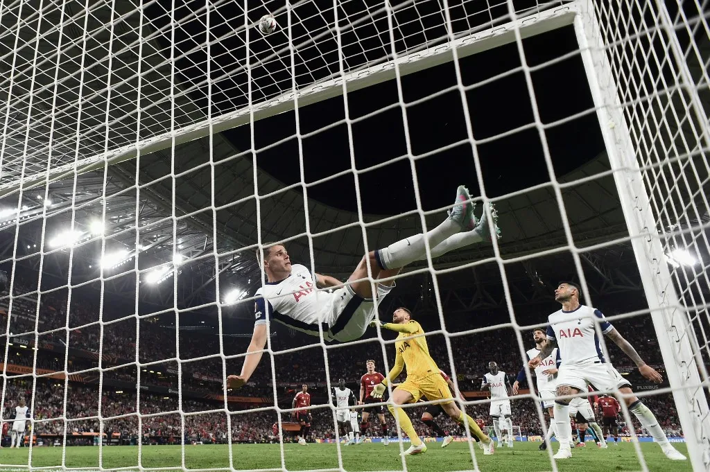 Tottenham Hotspur's Dutch defender #37 Micky van de Ven clears a shot by Manchester United's Argentinian forward #17 Alejandro Garnacho during the UEFA Europa League final football match between Tottenham Hotspur and Manchester United at San Mames stadium in Bilbao on May 21, 2025. (Photo by Josep LAGO / AFP)