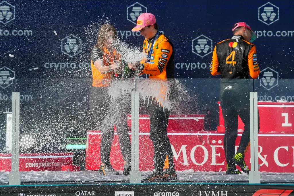 McLaren, Oscar Piastri, Lando Norris, and George Russell stand on the podium during the Formula 1 Crypto.Com Miami Grand Prix 2025 in Miami, USA, on May 4, 2025. ((Photo by Hasan Bratic/Alessio Morgese/NurPhoto) (Photo by Alessio Morgese / NurPhoto / NurPhoto via AFP)