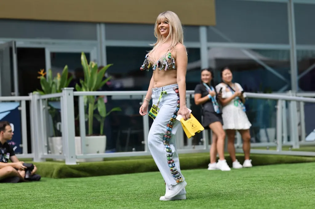 A woman dressed in a top made of toy cars arrives at the Miami International Autodrome in Miami, Florida, for the Formula 1 Crypto.com Miami Grand Prix. (Photo by Reginald Mathalone/NurPhoto) (Photo by Reginald Mathalone / NurPhoto / NurPhoto via AFP)