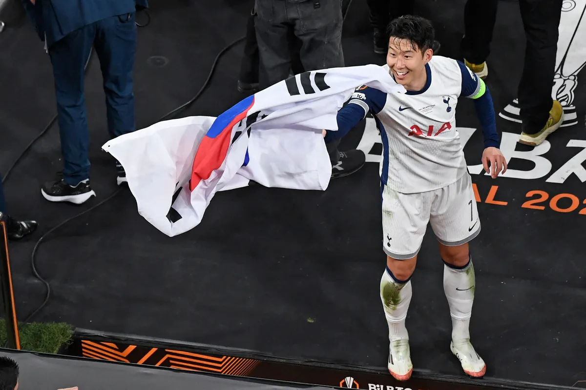 Tottenham Hotspur's South Korean forward #07 Son Heung-Min celebrates after the UEFA Europa League final football match between Tottenham Hotspur and Manchester United at the San Mames stadium in Bilbao on May 21, 2025. (Photo by ANDER GILLENEA / AFP)