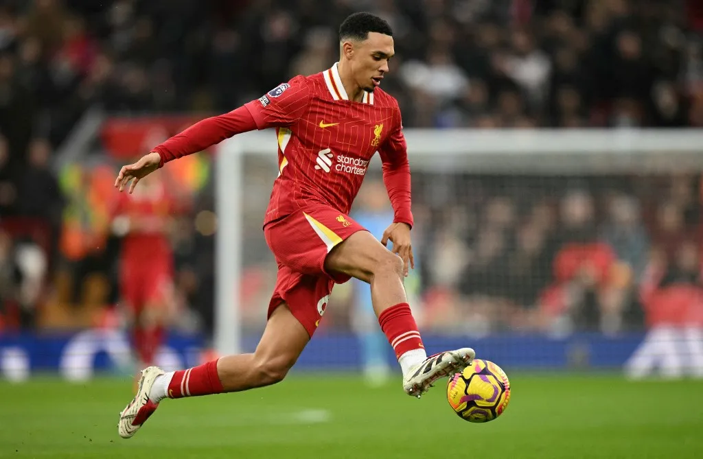 (FILES) Liverpool's English defender #66 Trent Alexander-Arnold controls the ball during the English Premier League football match between Liverpool and Fulham at Anfield in Liverpool, north west England on December 14, 2024. Trent Alexander-Arnold announced on May 5, 2025 he will leave boyhood club Liverpool when his contract expires at the end of the season, saying it was the "hardest decision" of his life. The England defender, who helped Liverpool win the Premier League this season, has been heavily linked with a free transfer to Real Madrid. (Photo by Oli SCARFF / AFP) / RESTRICTED TO EDITORIAL USE. No use with unauthorized audio, video, data, fixture lists, club/league logos or 'live' services. Online in-match use limited to 120 images. An additional 40 images may be used in extra time. No video emulation. Social media in-match use limited to 120 images. An additional 40 images may be used in extra time. No use in betting publications, games or single club/league/player publications. /