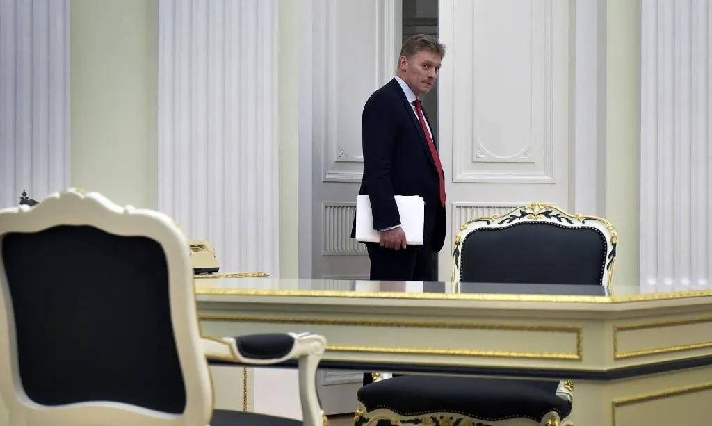 A picture taken on March 24, 2016 shows Kremlin spokesman Dmitry Peskov entering a hall at the Kremlin in Moscow. Dmitry Peskov (born October 17, 1967) is a Russian diplomat, and since 2012 the press spokesman for the President of Russia, Vladimir Putin. (Photo by ALEXANDER NEMENOV / AFP)