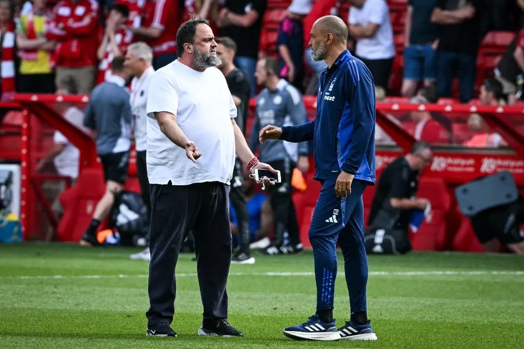 Nottingham Forest's Portuguese manager Nuno Espirito Santo (R) speaks with Nottingham Forest's Greek co-owner Evangelos Marinakis (L) at the end of the English Premier League football match between Nottingham Forest and Leicester City at The City Ground in Nottingham, central England, on May 11, 2025. Nottingham Forest and Leicester City equalise 2 - 2. (Photo by JUSTIN TALLIS / AFP) / RESTRICTED TO EDITORIAL USE. No use with unauthorized audio, video, data, fixture lists, club/league logos or 'live' services. Online in-match use limited to 120 images. An additional 40 images may be used in extra time. No video emulation. Social media in-match use limited to 120 images. An additional 40 images may be used in extra time. No use in betting publications, games or single club/league/player publications. / 