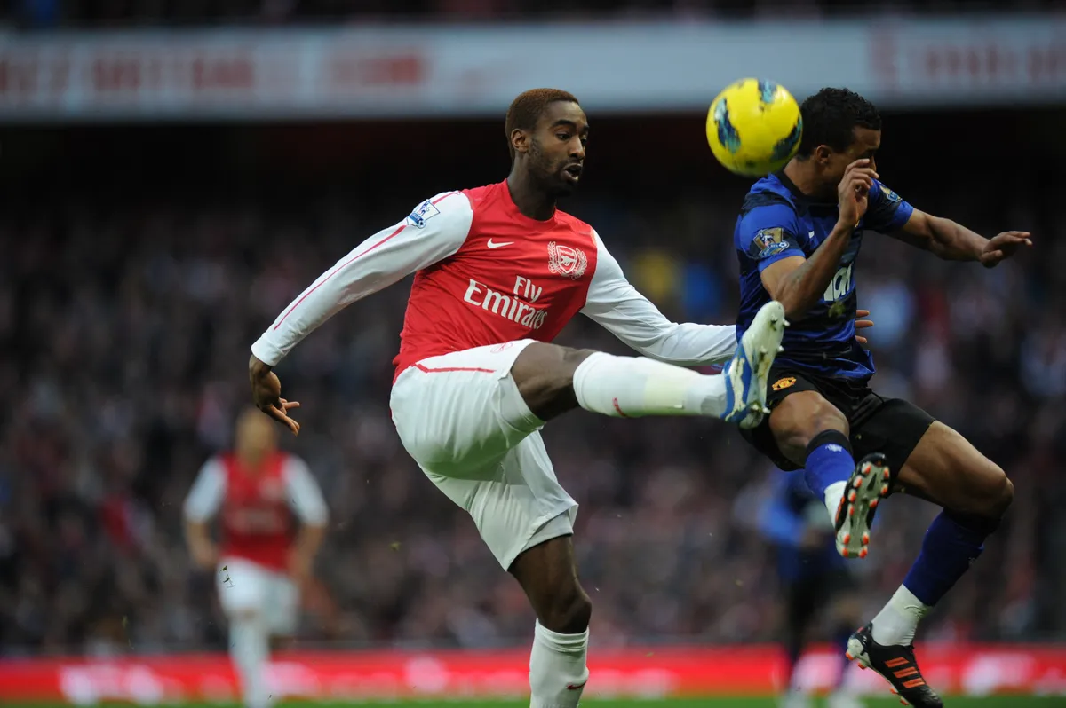 Arsenal's Swiss defender Johan Djourou (L) vies with Manchester United's French defender Patrice Evra (R) during their English Premier League football match against Manchester United at the Emirates Stadium in London, England on January 22, 2012. AFP PHOTO/ADRIAN DENNIS  
                                                                                                             
RESTRICTED TO EDITORIAL USE. No use with unauthorized audio, video, data, fixture lists, club/league logos or ÒliveÓ services. Online in-match use limited to 45 images, no video emulation. No use in betting, games or single club/league/player publications. (Photo by ADRIAN DENNIS / AFP)