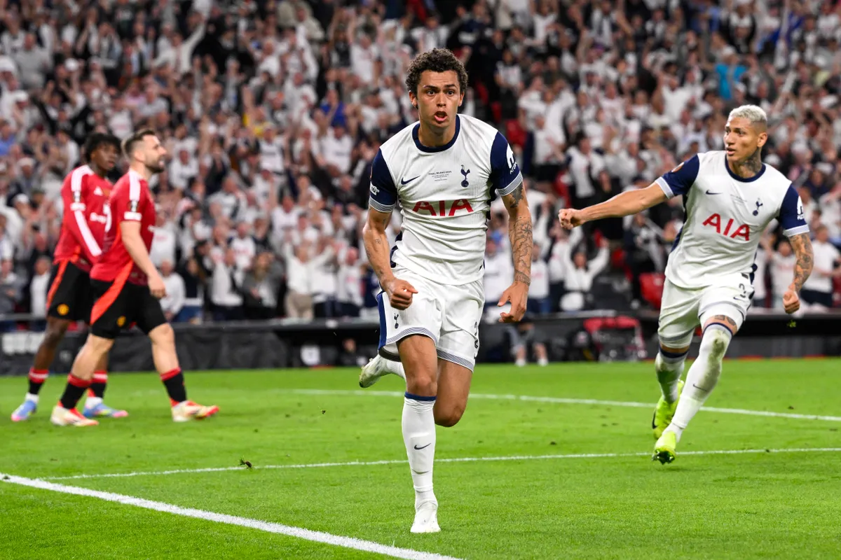 Tottenham Hotspur's Welsh forward #22 Brennan Johnson celebrates scoring the opening goal during the UEFA Europa League final football match between Tottenham Hotspur and Manchester United at San Mames stadium in Bilbao on May 21, 2025. (Photo by Josep LAGO / AFP)