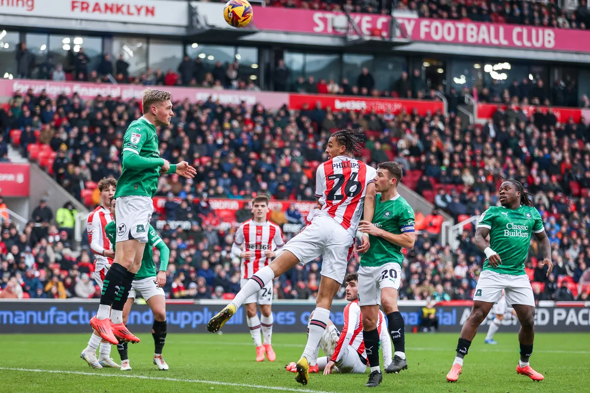 Marco Rossi, #6, Kornel Szucs of Plymouth Argyle (left) gets his head to the ball to deny Stoke City during the Sky Bet Championship match between Stoke City and Plymouth Argyle at the Britannia Stadium in Stoke-on-Trent, England, on January 4, 2025. (Photo by MI News/NurPhoto) (Photo by MI News / NurPhoto / NurPhoto via AFP)