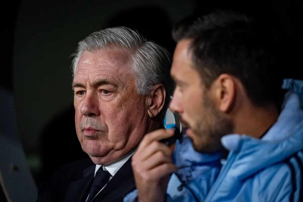 Carlo Ancelotti, head coach of Real Madrid CF, sits on the bench with Davide Ancelotti, assistant manager of Real Madrid CF, during the La Liga EA Sports 2024/25 football match between Real Madrid CF and Athletic Club Bilbao at Estadio Santiago Bernabeu in Madrid, Spain, on April 20, 2025. (Photo by Alberto Gardin/NurPhoto) (Photo by Alberto Gardin / NurPhoto / NurPhoto via AFP)
