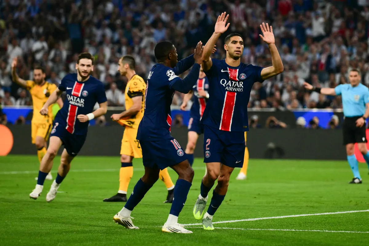 Paris Saint-Germain's Moroccan defender #02 Achraf Hakimi celebrates after scoring during the UEFA Champions League final football match between Paris Saint-Germain (PSG) and Inter Milan in Munich, southern Germany on May 31, 2025. (Photo by Marco BERTORELLO / AFP)