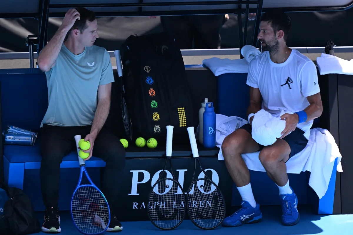 (FILES) Serbia's Novak Djokovic (R) talks to his coach Andy Murray during a practice session ahead of the Australian Open tennis tournament in Melbourne on January 11, 2025. Andy Murray will no longer be coaching former rival Novak Djokovic, the pair announced on May 13, 2025. (Photo by WILLIAM WEST / AFP) / -- IMAGE RESTRICTED TO EDITORIAL USE - STRICTLY NO COMMERCIAL USE --