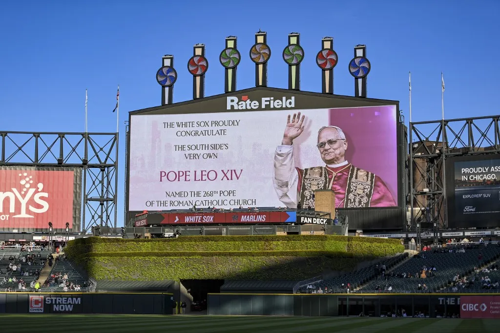 CHICAGO, ILLINOIS - MAY 9: The outfield video board displays a congratulatory message for Pope Leo XIV before the game between the Miami Marlins and the Chicago White Sox at Rate Field on May 9, 2025 in Chicago, Illinois.   Abigail Dean/Getty Images/AFP (Photo by Abigail Dean / GETTY IMAGES NORTH AMERICA / Getty Images via AFP)
