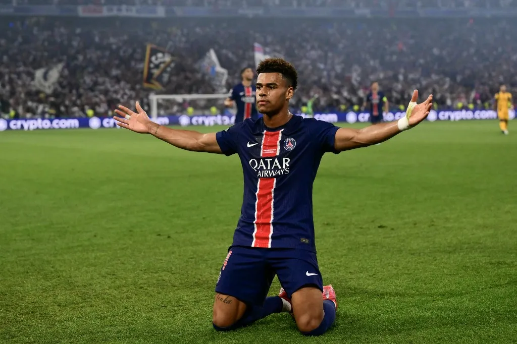 Paris Saint-Germain's French midfielder #14 Desire Doue celebrates after scoring during the UEFA Champions League final football match between Paris Saint-Germain (PSG) and Inter Milan in Munich, southern Germany on May 31, 2025. (Photo by Marco BERTORELLO / AFP)