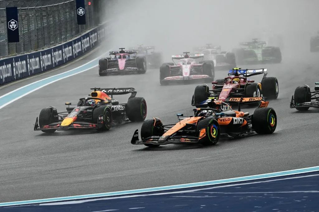 (L-R) Red Bull Racing's Dutch driver Max Verstappen and McLaren's British driver Lando Norris race during the 2025 Miami Formula One Sprint at Miami International Autodrome in Miami Gardens, Florida, on May 3, 2025. (Photo by Chandan Khanna / AFP)