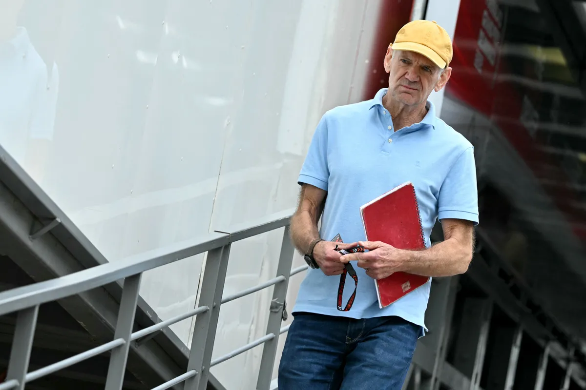 Red Bull Racing's technical chief Adrian Newey arrives in the pits of the Circuit de Monaco before the second practice session of the Formula One Monaco Grand Prix on May 24, 2024, two days ahead of the race. (Photo by ANDREJ ISAKOVIC / AFP)
