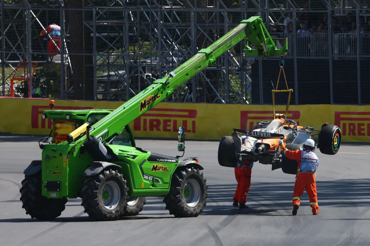 MONTREAL, QUEBEC - JUNE 15: Marshals remove the car of Lando Norris of Great Britain and McLaren from the circuit during the F1 Grand Prix of Canada at Circuit Gilles-Villeneuve on June 15, 2025 in Montreal, Quebec.   Clive Rose/Getty Images/AFP (Photo by CLIVE ROSE / GETTY IMAGES NORTH AMERICA / Getty Images via AFP)