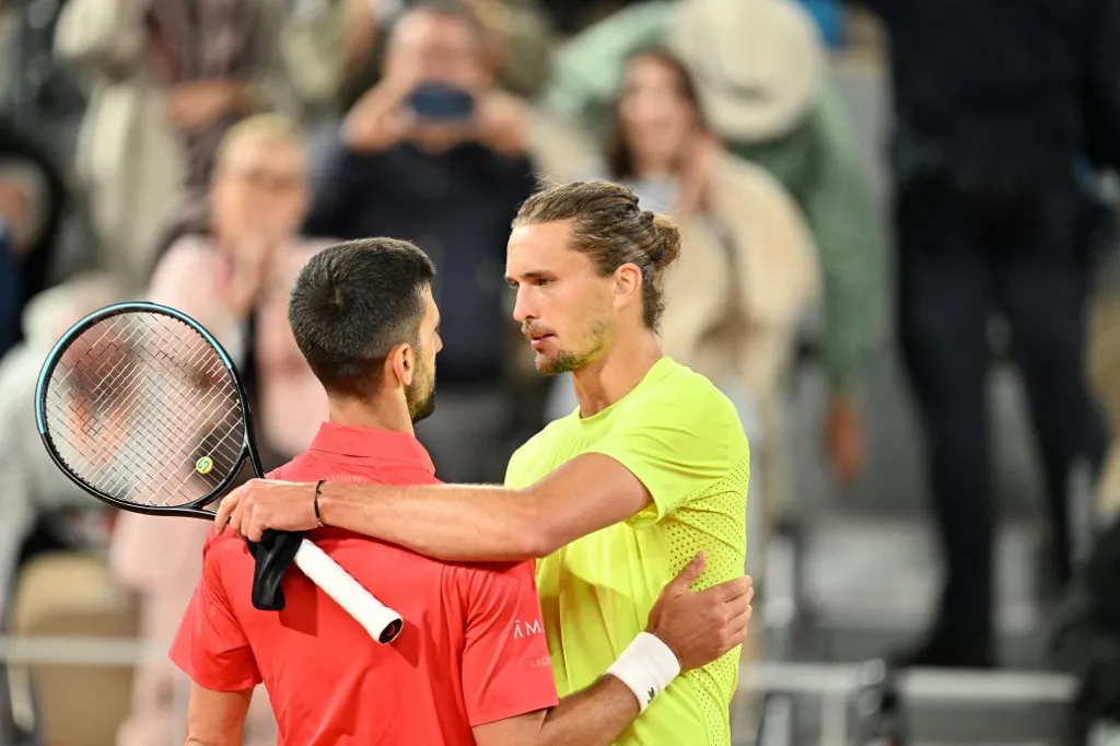 PARIS, FRANCE - JUNE 04: Novak Djokovic (L) of Serbia celebrates after winning against Alexander Zverev of Germany during the Men's Singles Quarter Final match on Day Eleven of the 2025 French Open at Roland Garros on June 04, 2025 in Paris, France. Mustafa Yalcin / Anadolu (Photo by MUSTAFA YALCIN / Anadolu via AFP)