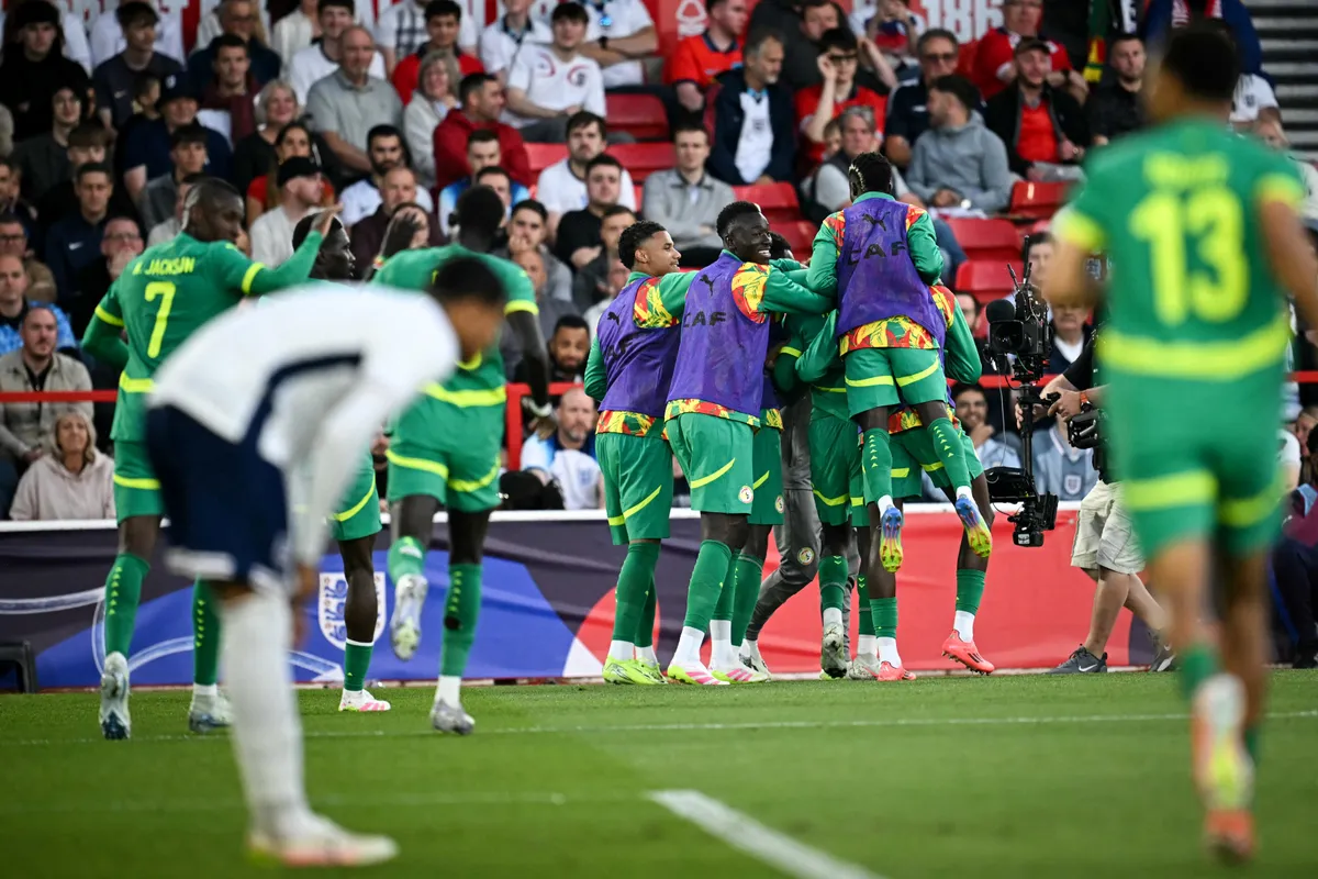 Tuchel, Senegal's forward #06 Habib Diarra (unseen) celebrates with teammates after scoring his team second goal during the international friendly football match between England and Senegal at the City Ground stadium, in Nottingham, on June 10, 2025. (Photo by Paul ELLIS / AFP) / NOT FOR MARKETING OR ADVERTISING USE / RESTRICTED TO EDITORIAL USE