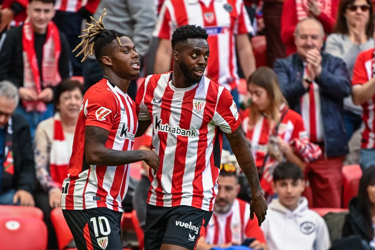 Athletic Bilbao's Spanish forward #10 Nico Williams (L) celebrates with Athletic Bilbao's Spanish forward #09 Inaki Williams after scoring their second goal during the Spanish league football match between Athletic Club Bilbao and Real Valladolid FC at San Mames Stadium in Bilbao on February 23, 2025. (Photo by ANDER GILLENEA / AFP)