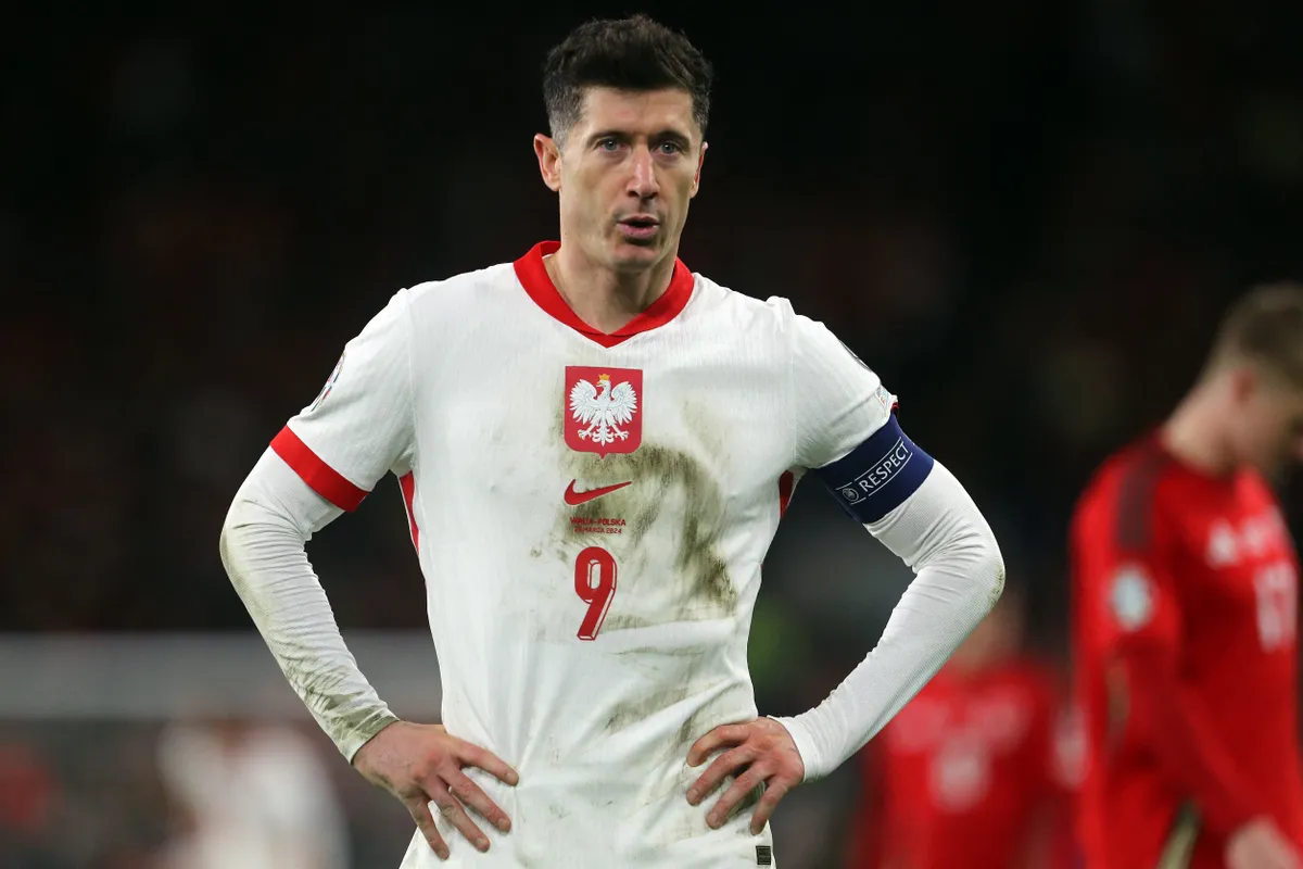(FILES) Poland's forward #09 Robert Lewandowski reacts during the UEFA EURO 2024 qualifier play-off final first leg football match between Wales and Poland at the Cardiff City Stadium, in Cardiff, on March 26, 2024. Barcelona striker Robert Lewandowski said on June 8, 2025 he would boycott his national team Poland so long as coach Michal Probierz remained in charge. (Photo by Geoff Caddick / AFP)