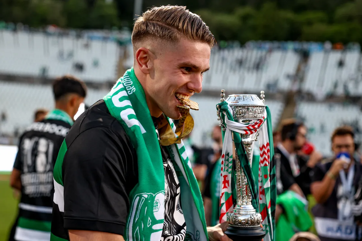 Viktor Gyokeres, forward of Sporting CP, celebrates with the trophy at the end of the 'Taca de Portugal' (Portugal's Cup) match between SL Benfica and Sporting CP at Estadio Nacional in Oeiras, Portugal, on May 25, 2025. (Photo by Valter Gouveia/NurPhoto) (Photo by Valter Gouveia / NurPhoto via AFP)