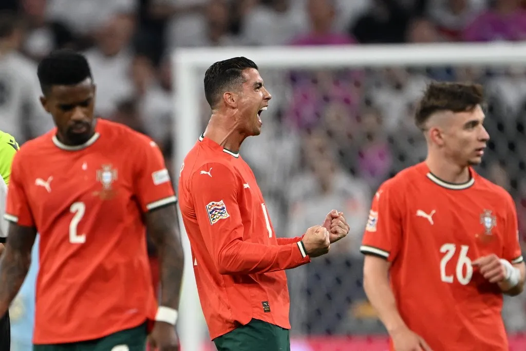 MUNICH, GERMANY - JUNE 04: Cristiano Ronaldo of Portugal and team-mates celebrate after scoring a goal during the UEFA Nations League 2025 semi-final match between Germany and Portugal at the Allianz Arena Stadium on June 4, 2025, Munich, Germany. Halil Sagirkaya / Anadolu (Photo by HALIL SAGIRKAYA / Anadolu via AFP)