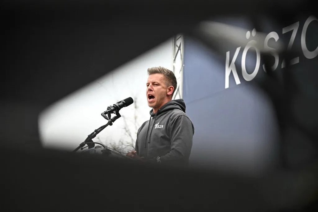 Leader of TISZA party Peter Magyar addresses activists and sympathisers of Hungary's main opposition party, the TISZA (Respect and Freedom) during a rally in Budapest on April 13, 2025. The TISZA party has concluded a two-week self-styled "referendum" on Sunday, The initiative -- dubbed "Voice of the Nation" -- is widely seen as a mobilisation exercise ahead of the election scheduled for next spring. (Photo by Attila KISBENEDEK / AFP)